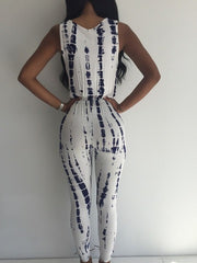 WHITE GEAR PRINTED SLEEVELESS DEEP V JUMPSUITS